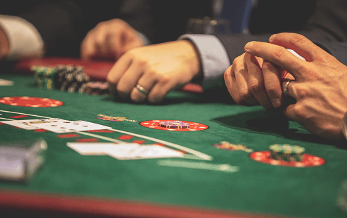 Best Blackjack Tips - Photo of Players' hands at Blackjack Table